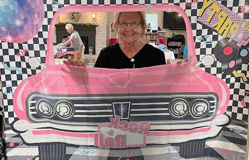 Resident enjoying a themed photo booth activity