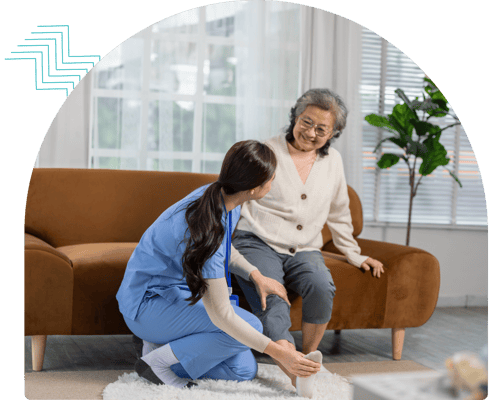 Care worker assisting a smiling senior resident