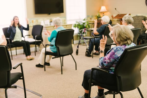 Residents participating in an activity session in a common room