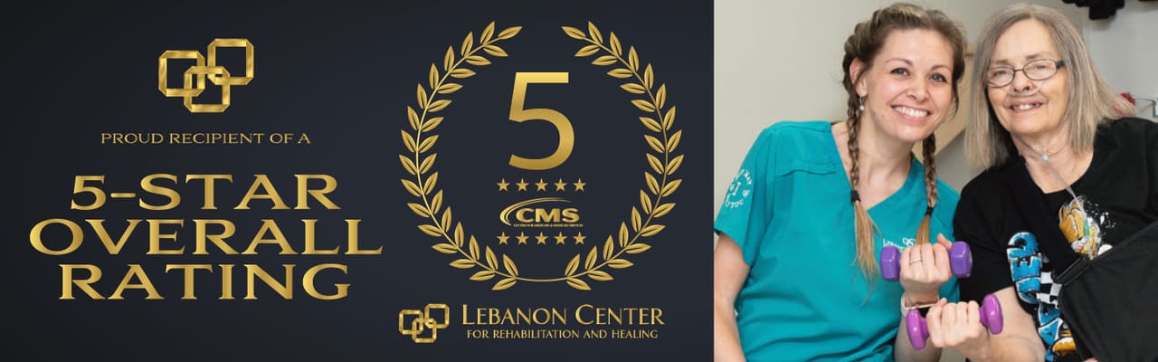 Staff member assisting a resident with weights