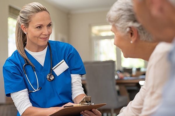 Nurse interacting with a resident in a comfortable setting