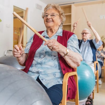 Residents participating in an activity using exercise balls