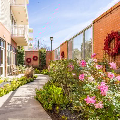 Well-maintained garden area with flowers and seating