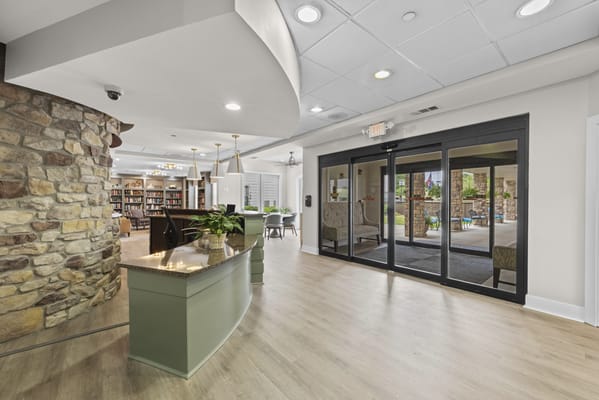 Interior view of a common area with bookshelves and seating