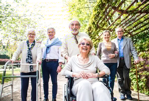 Residents enjoying a sunny day in the garden together