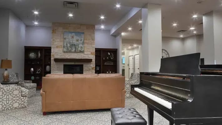 Common area in a senior living facility with a piano