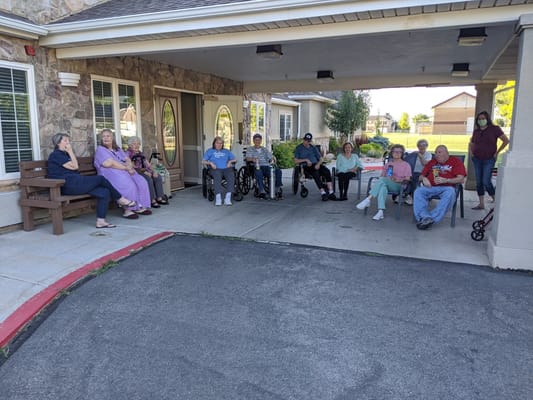 Residents enjoying time outside the facility