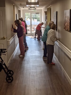 Residents participating in an activity in a hallway