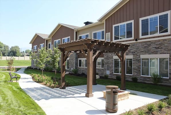Outdoor area with pergola and landscaping