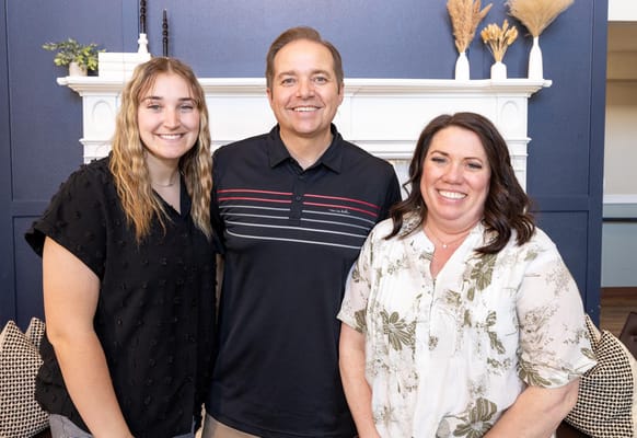 Staff members smiling in a cozy common area