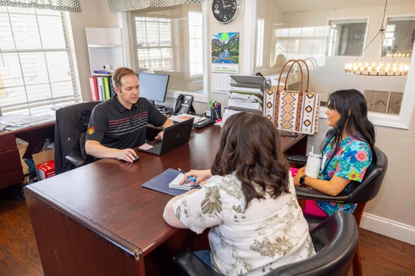 Staff meeting with residents in a comfortable office