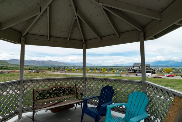 Outdoor gazebo with seating and mountain view