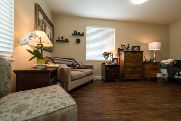 Cozy resident room with furniture and personal touches