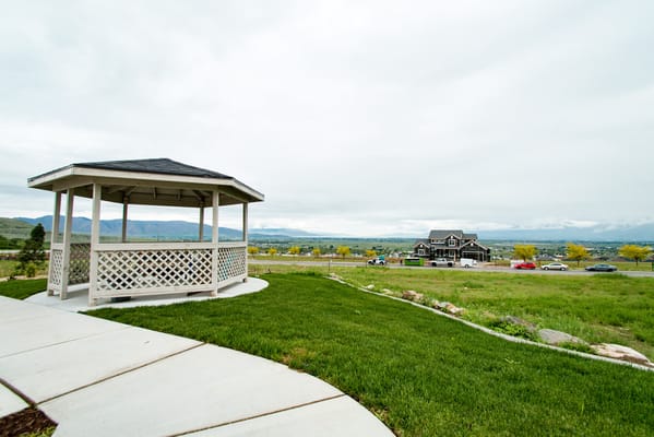 Outdoor gazebo with the facility building in the background