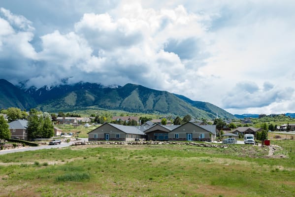 Assisted living facility with mountains in the background