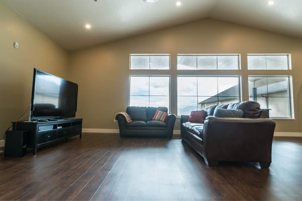 Interior of a common area with sofas and a TV