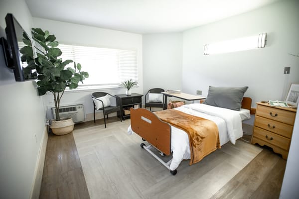 A comfortable private resident room with modern decor