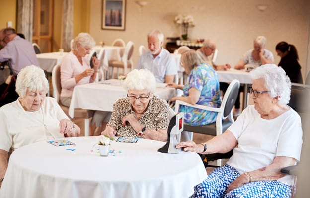 Residents playing bingo in a common area