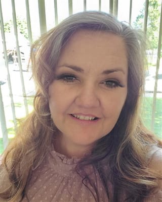 Close-up portrait of a staff member smiling