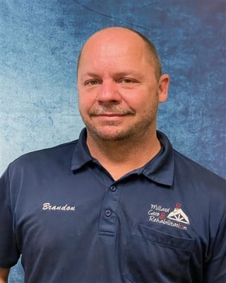 Staff member in a branded polo shirt