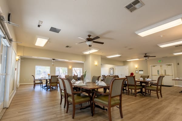 Dining area with tables set for residents