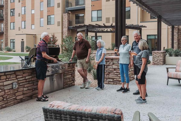 Residents enjoying a barbecue in an outdoor space