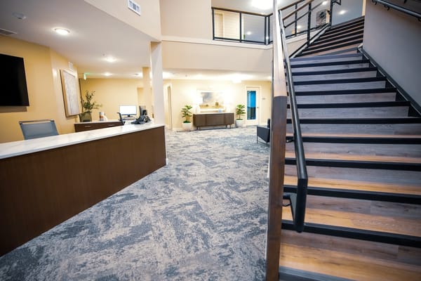 Interior view of a reception area with staircase