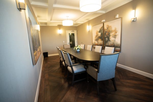 Interior view of a dining area with a large table and chairs