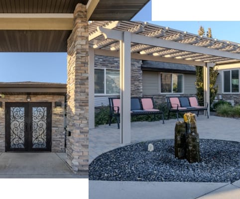 Entrance to a senior living facility with outdoor seating