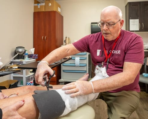 Healthcare professional providing treatment to a resident