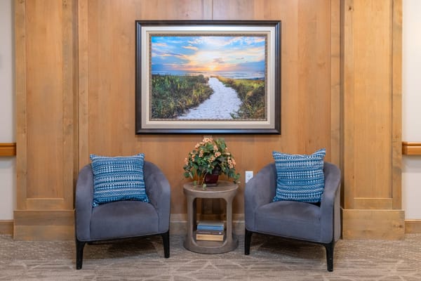 Cozy seating area with artwork and plants