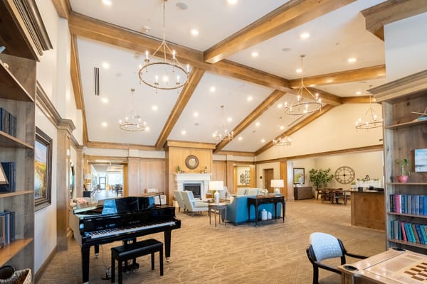 Bright lobby area with piano and seating