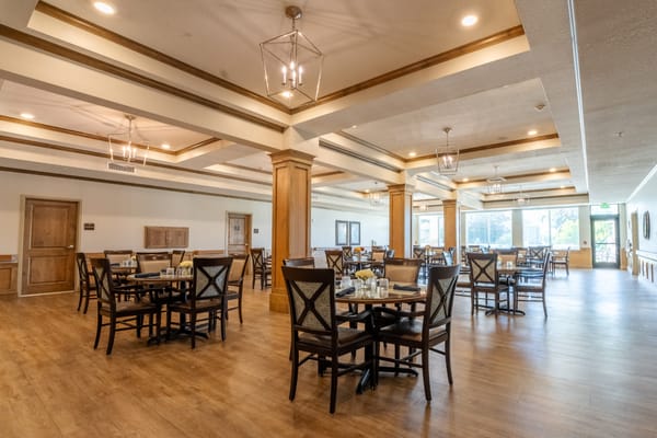 Interior dining area with wooden tables and chairs