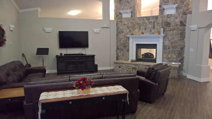 Common area with comfortable seating and a fireplace