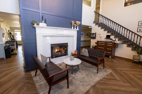 Cozy common area with seating and a fireplace