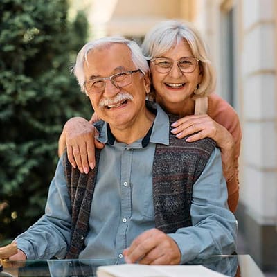Smiling elderly couple enjoying time together outdoors