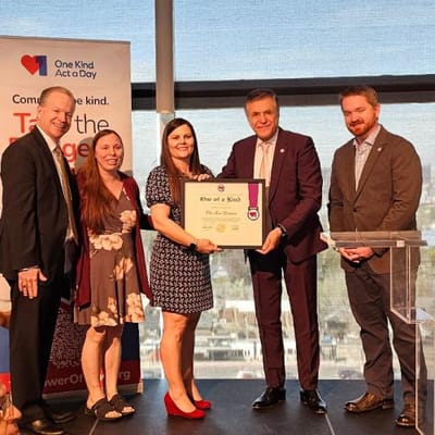Staff receiving an award at a recognition ceremony