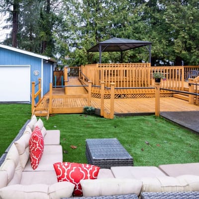 Outdoor seating area with wooden deck and gazebo