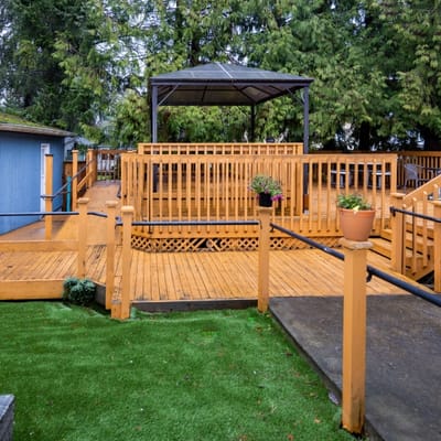 Outdoor deck area with gazebo and wooden railings