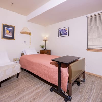 Cozy resident room with a bed and furniture