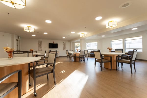 Bright interior common area with tables and chairs