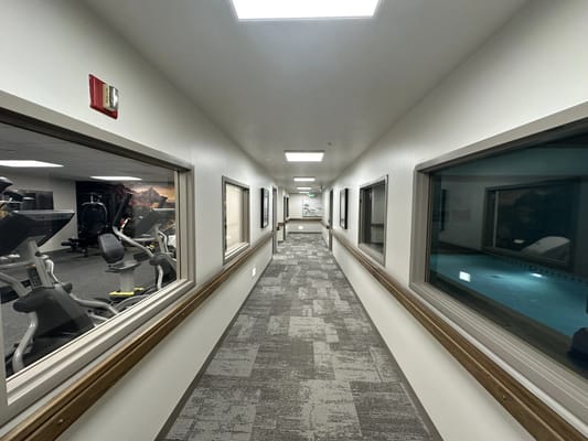 Interior hallway leading to fitness area