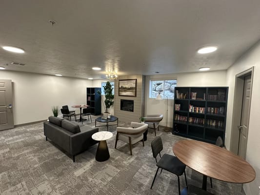 Interior common area with seating and bookshelves