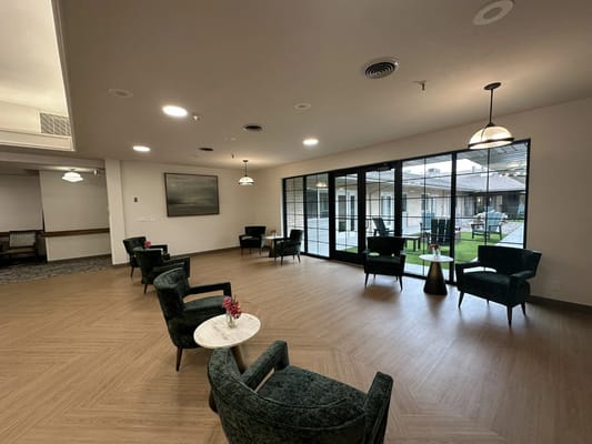 Interior lounge area with chairs and windows