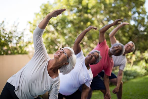 Residents participating in a yoga class outdoors