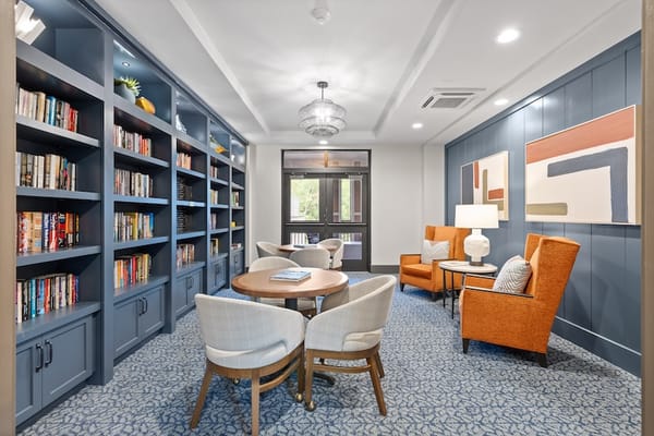 Cozy library area with bookshelves and seating