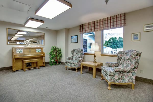 Interior lounge area with comfortable seating and piano