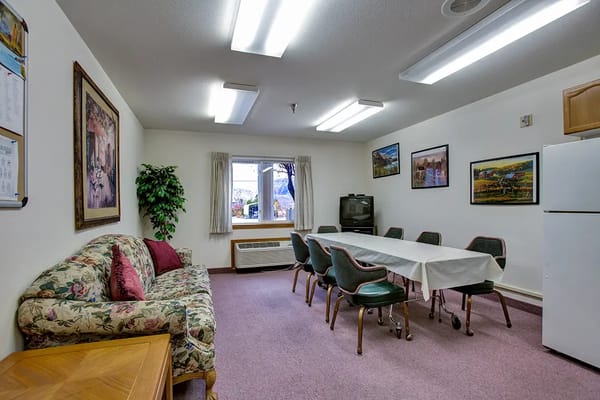Interior view of a common area with seating and dining table