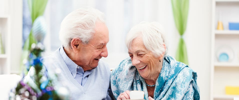 Elderly couple enjoying time together in a cozy setting