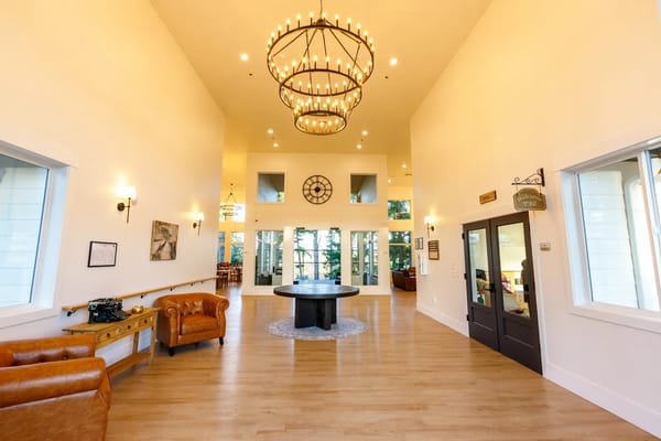 Bright interior of the main common area with large windows